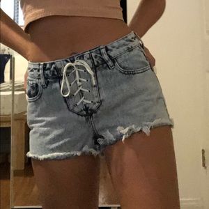 Jean shorts with lace up tie.